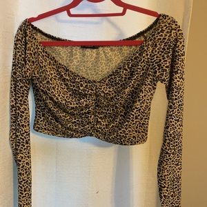 Cheetah off the shoulder Roche top